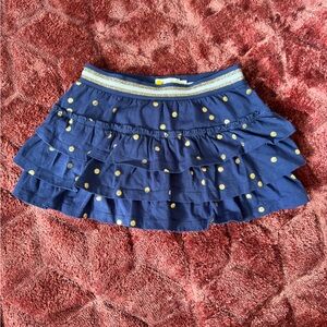 Mini Boden skort. Size 4/5. Navy ruffle with metallic print. Great condition.